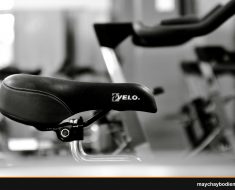 Detailed black and white shot of a gym bicycle saddle, highlighting fitness equipment aesthetics.
