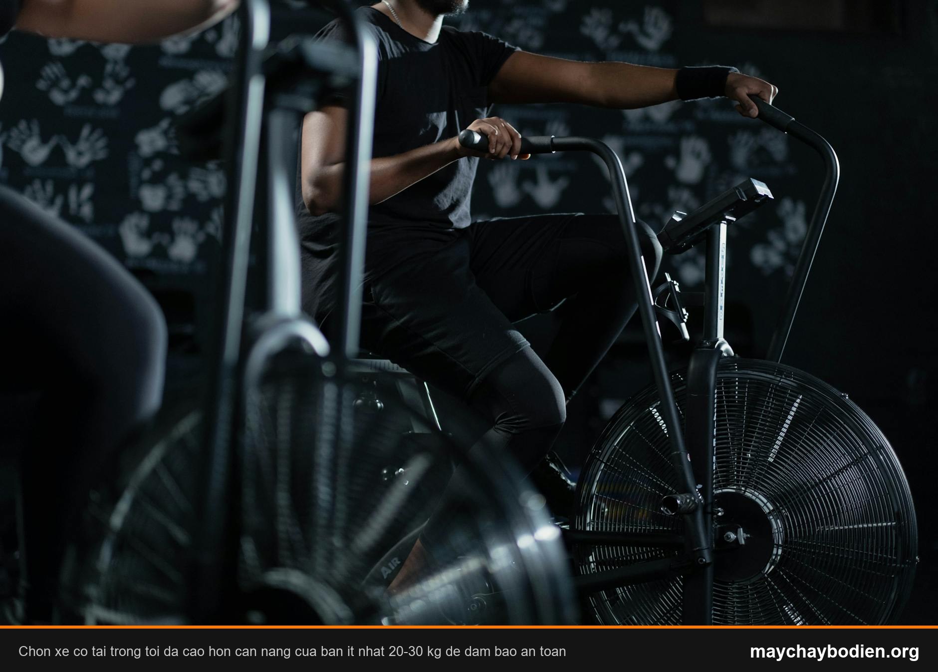 A person engaged in an intense indoor cycling workout on a stationary exercise bike, promoting fitness and healthy living.
